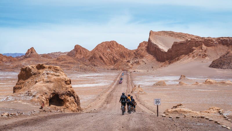 Cyclists at the Moon Valley Spanish: Valle de La Luna  in the Atacama Desert, northern Chile, South America. Cyclists at the Moon Valley Spanish: Valle de La Luna  in the Atacama Desert, northern Chile, South America.