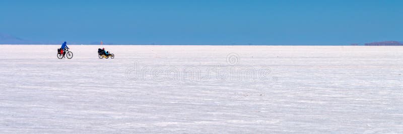 Cyclists in Salar de Uyuni Uyuni salt flats, Potosi, Bolivia. Cyclists in Salar de Uyuni Uyuni salt flats, Potosi, Bolivia