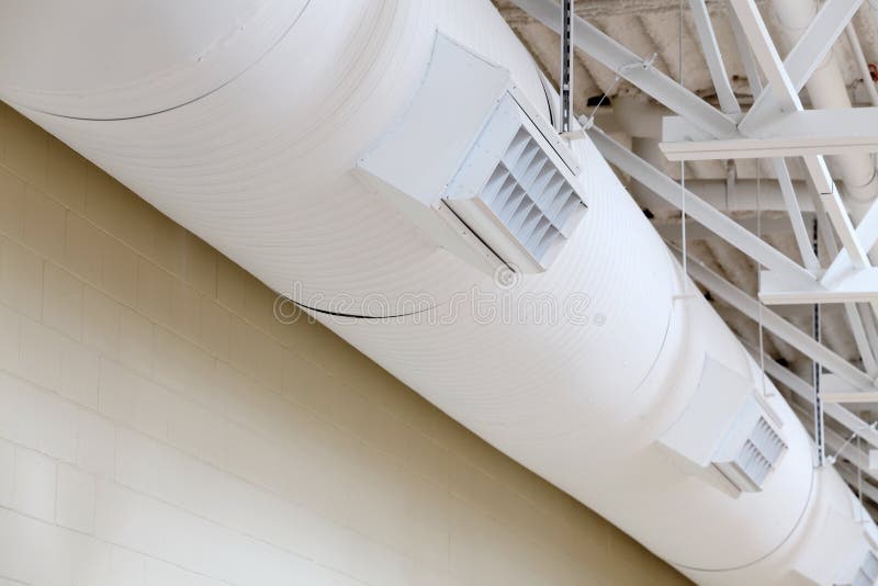 Exposed duct work suspended from a ceiling in a modern HVAC system in a new school.n. Exposed duct work suspended from a ceiling in a modern HVAC system in a new school.n