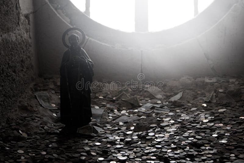 A figure of a saint in a dark place with light coming from behind highlighting lot of coins underfoot. A figure of a saint in a dark place with light coming from behind highlighting lot of coins underfoot