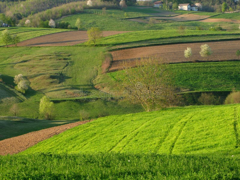 Spring landscape with cultivated land in front. Spring landscape with cultivated land in front