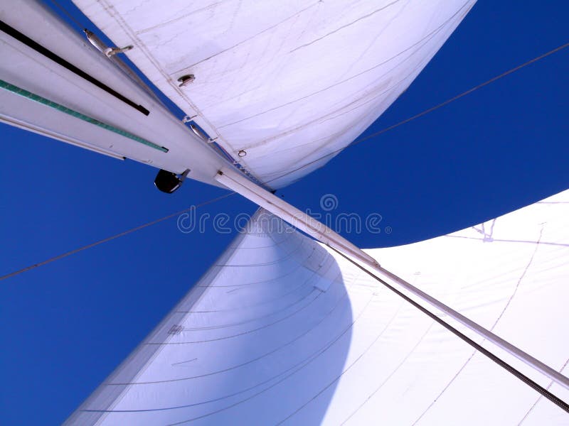 Sails against the blue of the sky. Sails against the blue of the sky