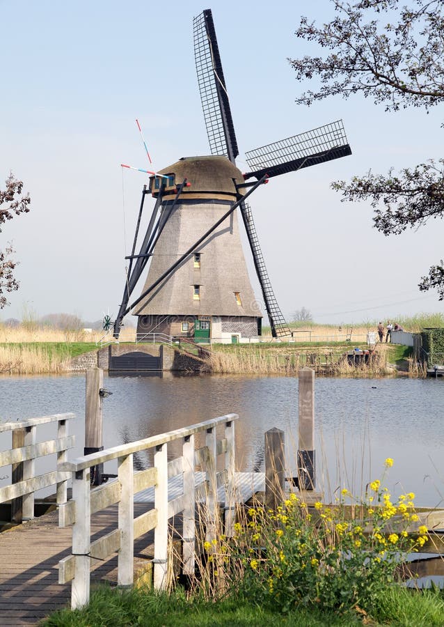 KINDERDIJK, NETHERLANDS - APRIL 1: Windmills at open air musem at Kinderdijk on April 1, 2014 in Kinderdijk. KINDERDIJK, NETHERLANDS - APRIL 1: Windmills at open air musem at Kinderdijk on April 1, 2014 in Kinderdijk