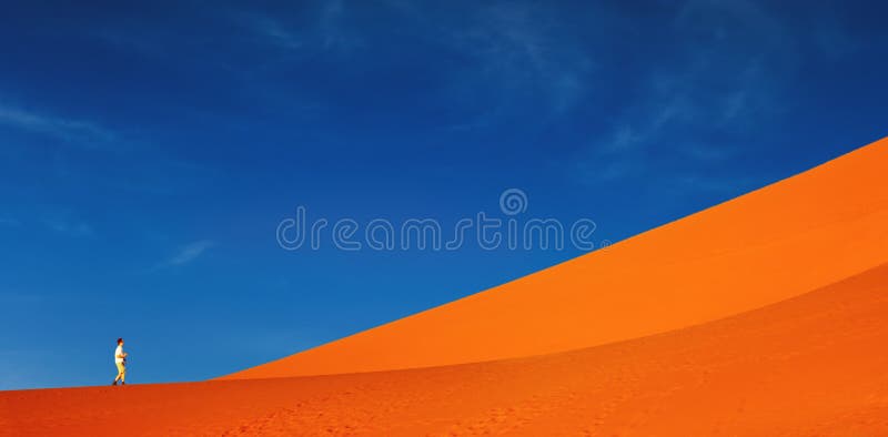 Sand dune climbing, Namib Desert, Sossusvlei, Namibia. Sand dune climbing, Namib Desert, Sossusvlei, Namibia