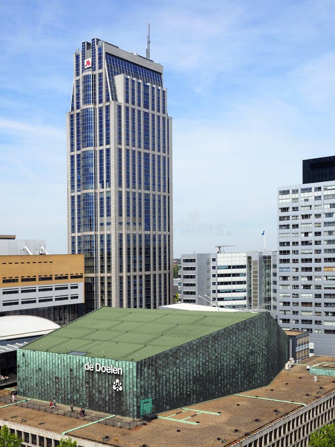 Rotterdam, Netherlands - June, 2, 2019: The Millenium tower is designed by WZMH architects and AGS architecten.  On the foreground is the roof of theater De Doelen. Rotterdam, Netherlands - June, 2, 2019: The Millenium tower is designed by WZMH architects and AGS architecten.  On the foreground is the roof of theater De Doelen