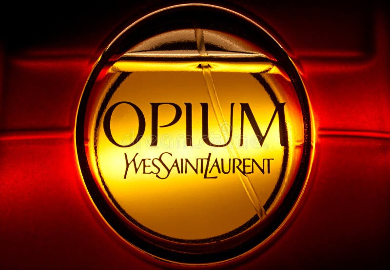 Closeup of Opium from Yves Saint Laurent perfume on golden background. Closeup of Opium from Yves Saint Laurent perfume on golden background