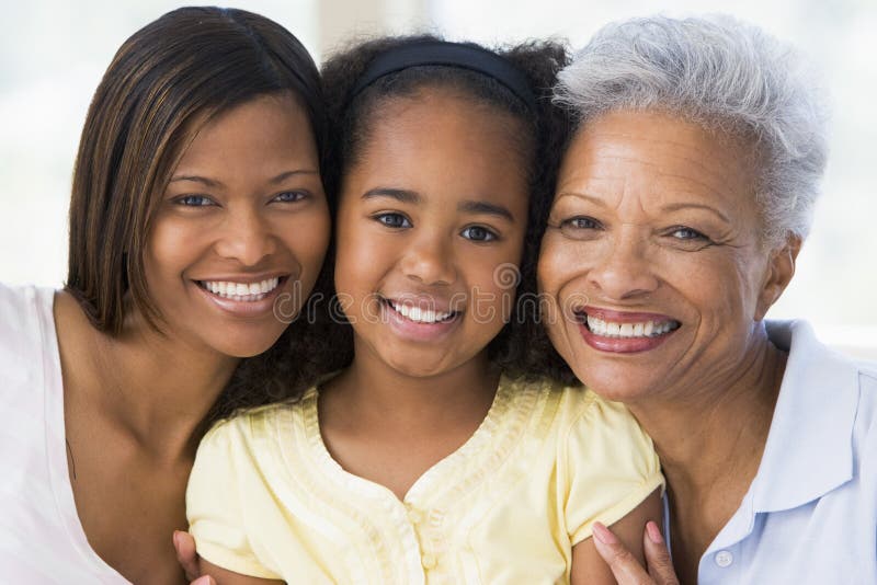 Grandmother with adult daughter and grandchild smiling. Grandmother with adult daughter and grandchild smiling