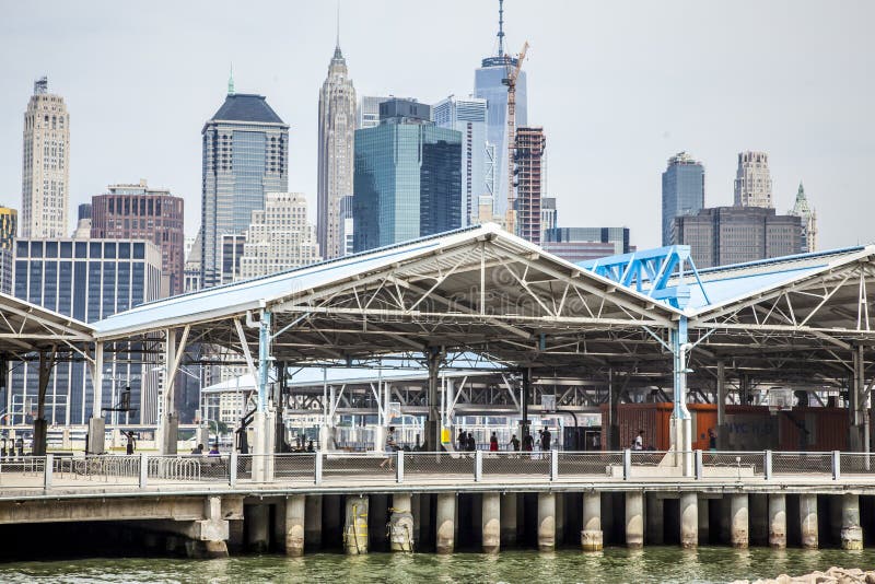 New York CIty, USA - July 7, 2018; View of pier 2 in Brooklyn with unrecognizable people playing basketball during summer daytime on July 7, 2018 in New York CIty. New York CIty, USA - July 7, 2018; View of pier 2 in Brooklyn with unrecognizable people playing basketball during summer daytime on July 7, 2018 in New York CIty