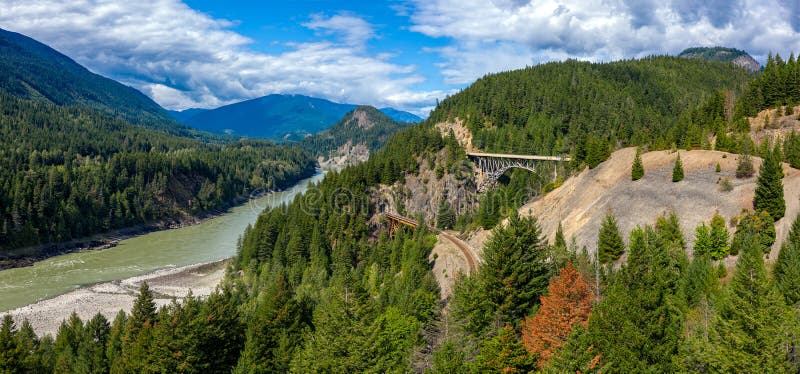 Aerial panorama photo of the Fraser River and the Ainslie Creek Bridge on Highway 1 in the Fraser Canyon, British Columbia, Canada. Aerial panorama photo of the Fraser River and the Ainslie Creek Bridge on Highway 1 in the Fraser Canyon, British Columbia, Canada