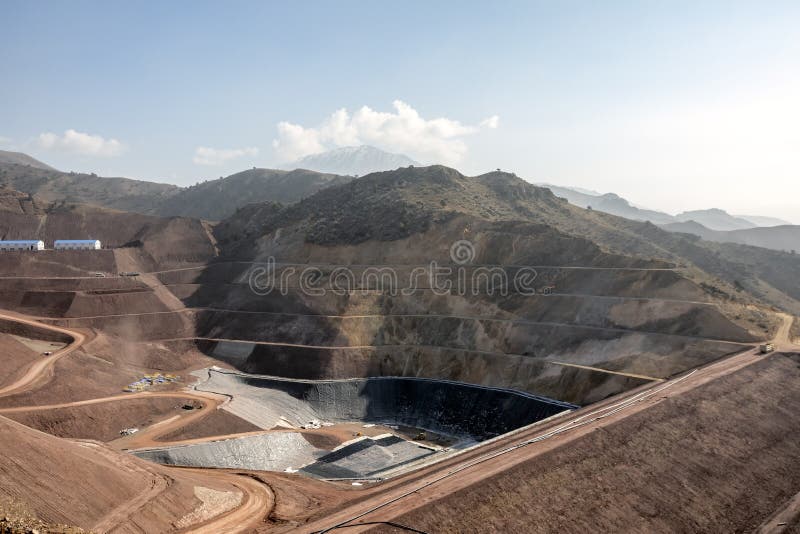 View of the tailings dam or waste dam construction and sealing membrane assembly for mining site. View of the tailings dam or waste dam construction and sealing membrane assembly for mining site.