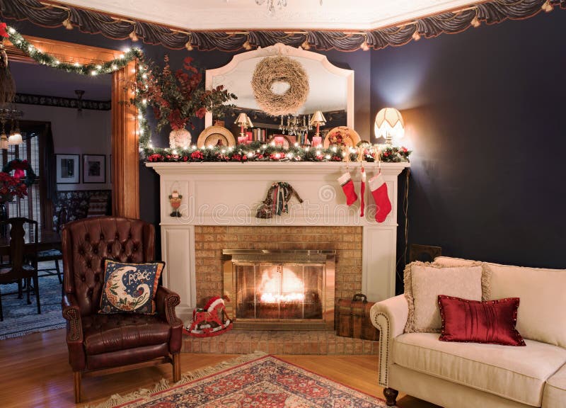 Christmas decor with fireplace in old Victorian living room with copy space on wall. Christmas decor with fireplace in old Victorian living room with copy space on wall.