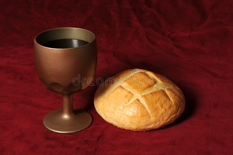 Communion elements represented by bread and wine over a red background. Communion elements represented by bread and wine over a red background