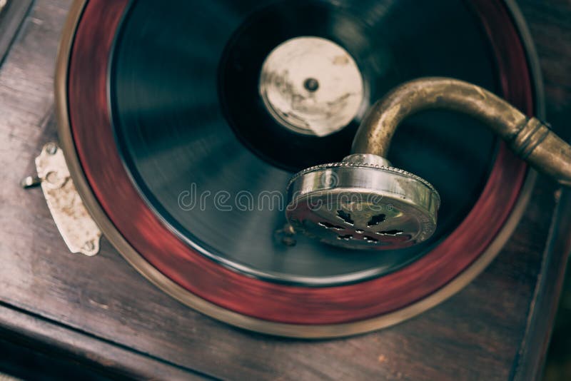 Vintage gramophone turntable vinyl record player close up, top view, toned. Vintage gramophone turntable vinyl record player close up, top view, toned