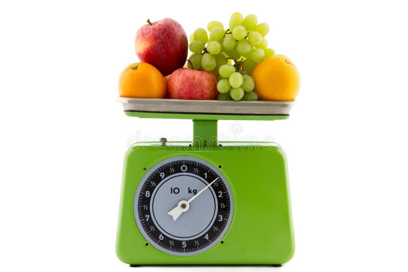 Green vintage kitchen scale with oranges, apples and white grapes. Green vintage kitchen scale with oranges, apples and white grapes