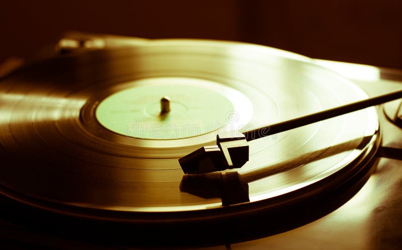 Vintage record player with vinyl disc, close-up. Vintage record player with vinyl disc, close-up.