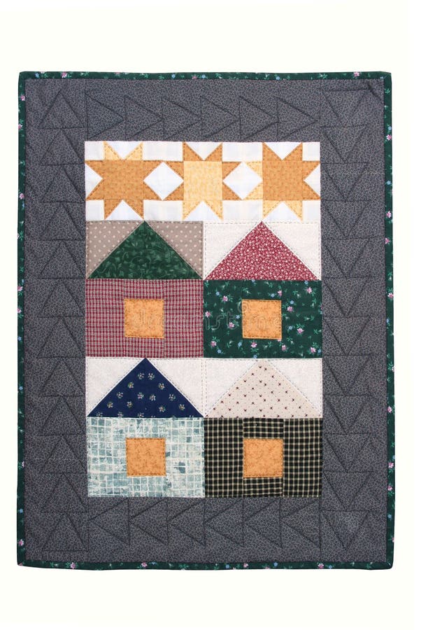 Quilted wall hanging with a house and star pattern. Quilted wall hanging with a house and star pattern.