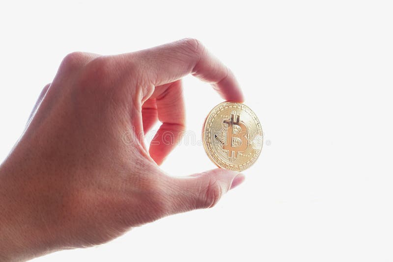 Владение руки bitcoin золота стоковая фотография Владение руки bitcoin золота стоковая фотография