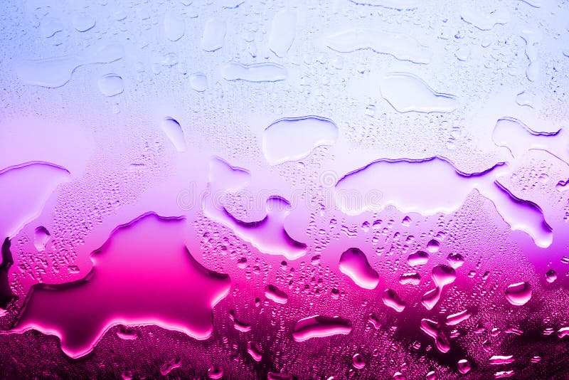 Wet glass surface, water drops, gradient color from blue to red, illustration of world warming, texture of spilled water in bright colors, abstract background, layout, condensate drops on glass. Wet glass surface, water drops, gradient color from blue to red, illustration of world warming, texture of spilled water in bright colors, abstract background, layout, condensate drops on glass