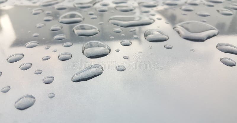 Вода падает предпосылка на лоснистой поверхности стоковые изображения Вода падает предпосылка на лоснистой поверхности стоковые изображения