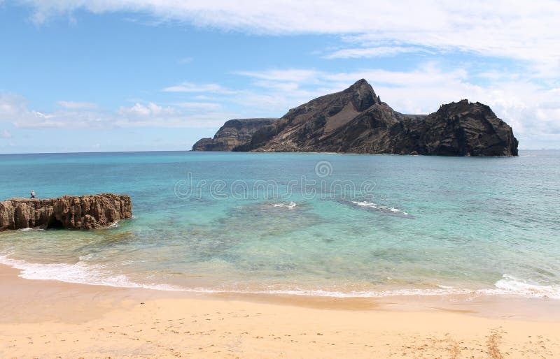 Porto Santo warm bright waters, near Islet of Cal, Calheta beach, at the SW most point of this calm Portuguese island. Cristiano Ronaldo planned to build a 5 stars resort here, not far from Madeira. Porto Santo warm bright waters, near Islet of Cal, Calheta beach, at the SW most point of this calm Portuguese island. Cristiano Ronaldo planned to build a 5 stars resort here, not far from Madeira.