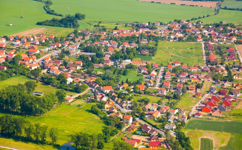 Aerial view of countryside with village and farmland. Aerial view of countryside with village and farmland