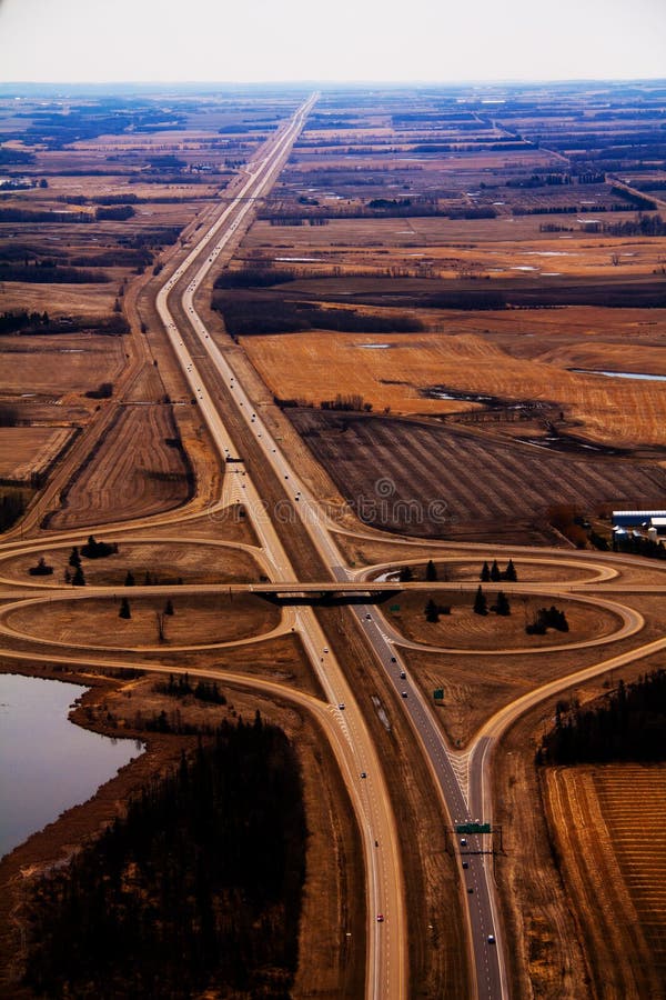 An aerial view of 2 highways intersecting. An aerial view of 2 highways intersecting