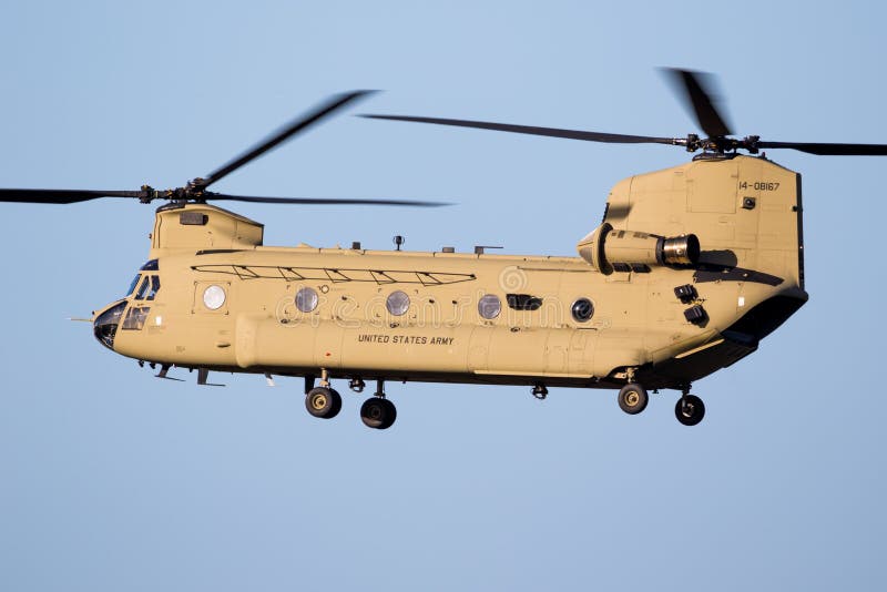 EINDHOVEN, THE NETHERLANDS - OCT 27, 2017: United States Army Boeing CH-47F Chinook transport helicopter in flight. EINDHOVEN, THE NETHERLANDS - OCT 27, 2017: United States Army Boeing CH-47F Chinook transport helicopter in flight.