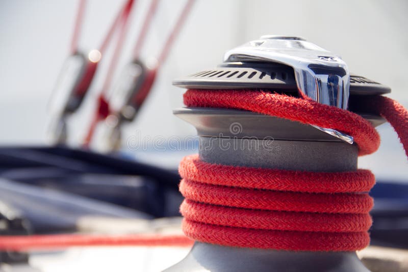 Yacht winch with the red rope. Yacht winch with the red rope