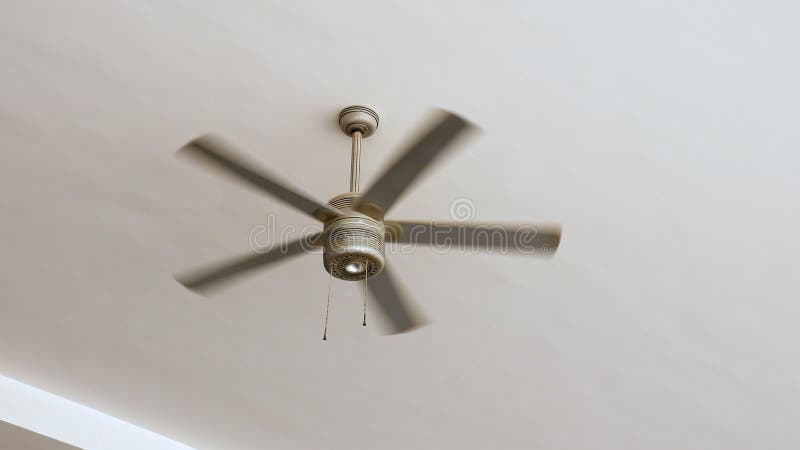 Ceiling fan is rotating at the ceiling of the room. Electric climate equipment. Ceiling fan is rotating at the ceiling of the room. Electric climate equipment.