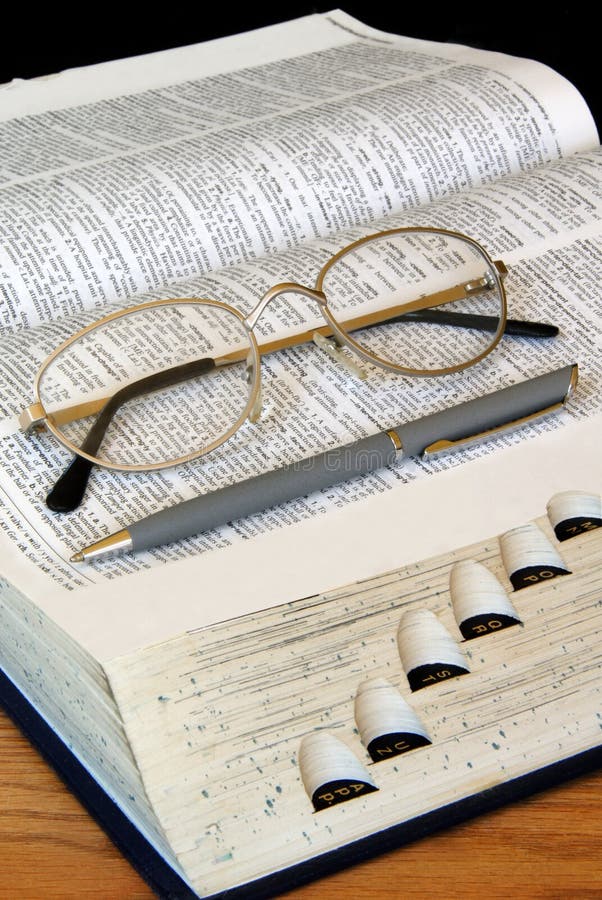 Open Dictionary with Pen and Glasses. Open Dictionary with Pen and Glasses