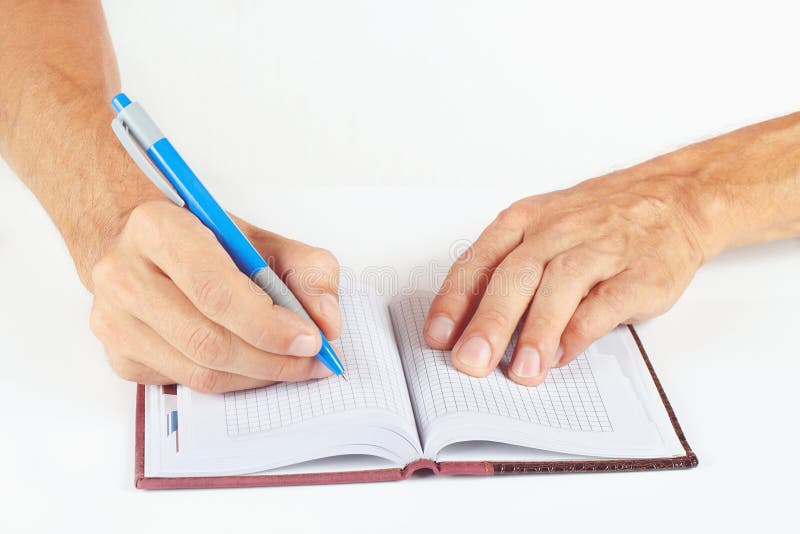Hand written notes in pen in a notebook on a white background. Hand written notes in pen in a notebook on a white background