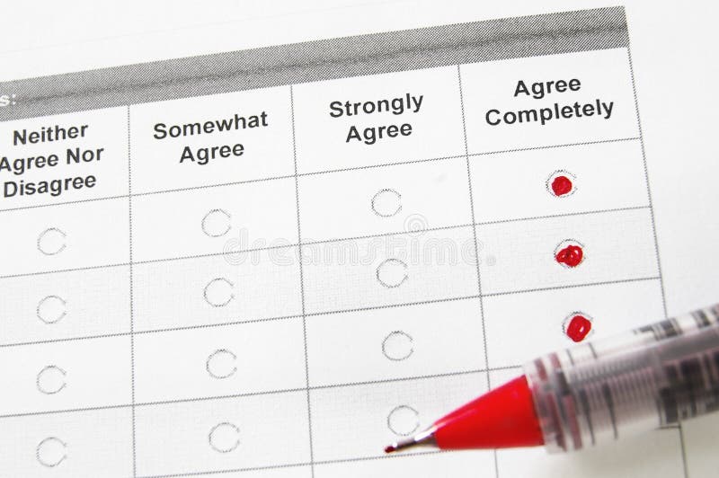 Closeup of a survey form with agree remarks checked. Closeup of a survey form with agree remarks checked