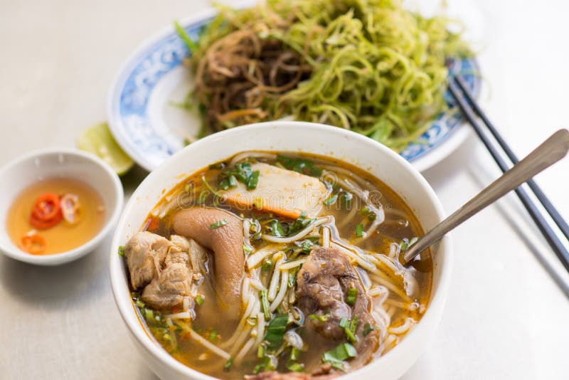 Vietnamese noodle soup Bun Bo Hue with fish source. Vietnamese noodle soup Bun Bo Hue with fish source