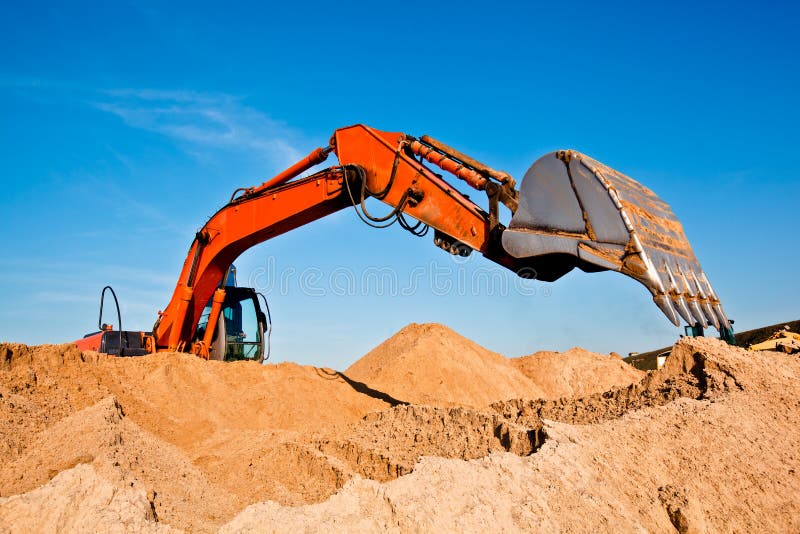 Excavator Digging Sand at a Sand Quarry. Excavator Digging Sand at a Sand Quarry