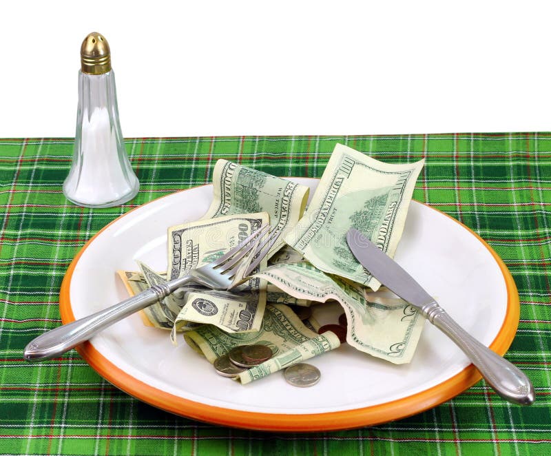 Plate full of money concept for the rising price of food with a pure white background. Plate full of money concept for the rising price of food with a pure white background