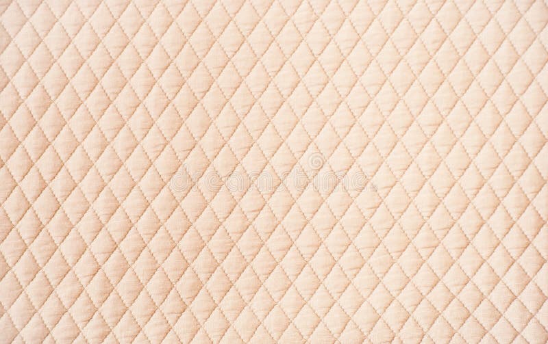 Beige color quilted pattern background. Beige color quilted pattern background