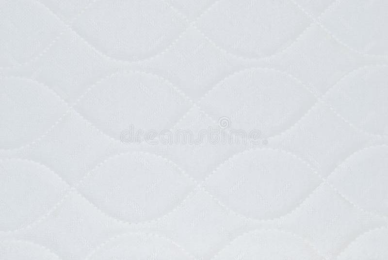 Ivory white quilted background with pretty patterns. Ivory white quilted background with pretty patterns