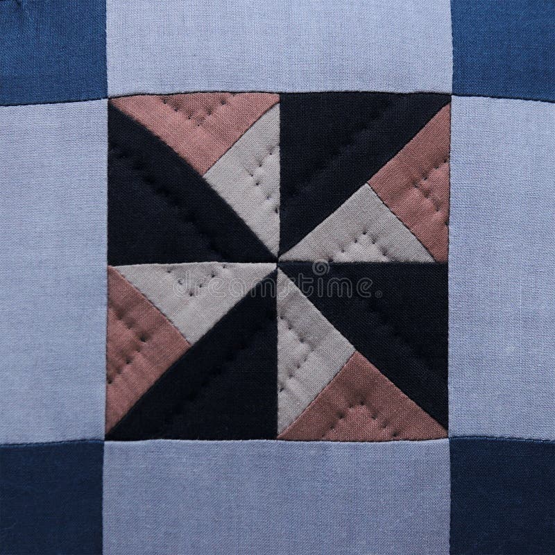 Quilted fabric in squares and triangles. Quilted fabric in squares and triangles