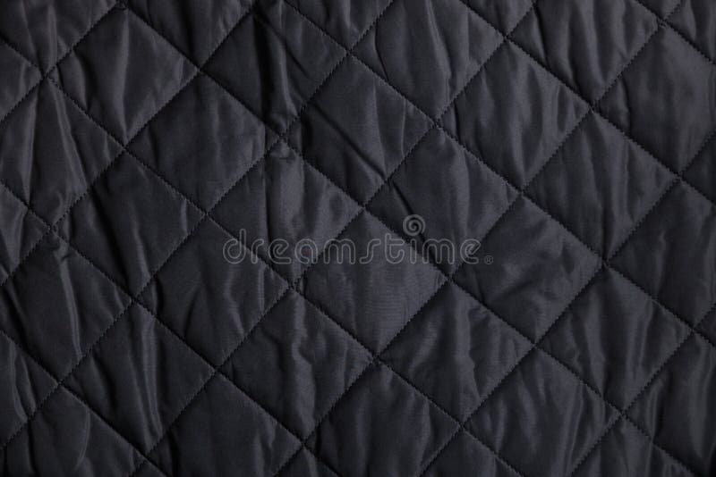 Some black fabric with quilted diamond shapes stitched in. Some black fabric with quilted diamond shapes stitched in.