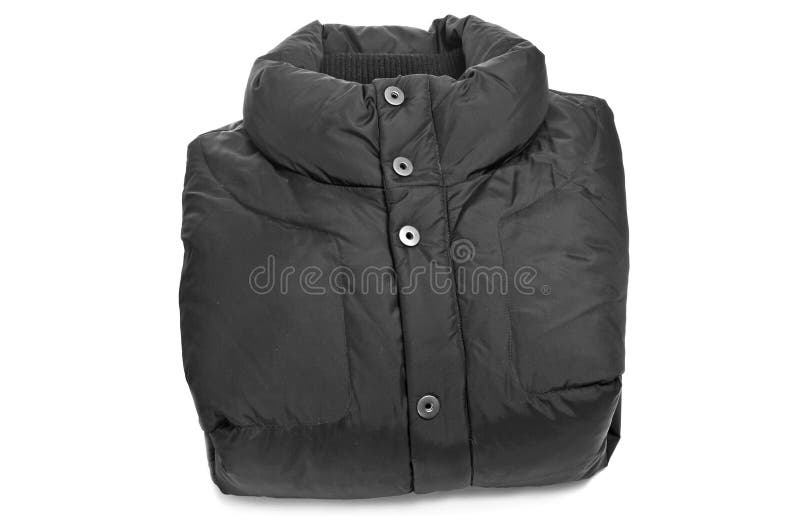 Folded black quilted anorak on a white background. Folded black quilted anorak on a white background