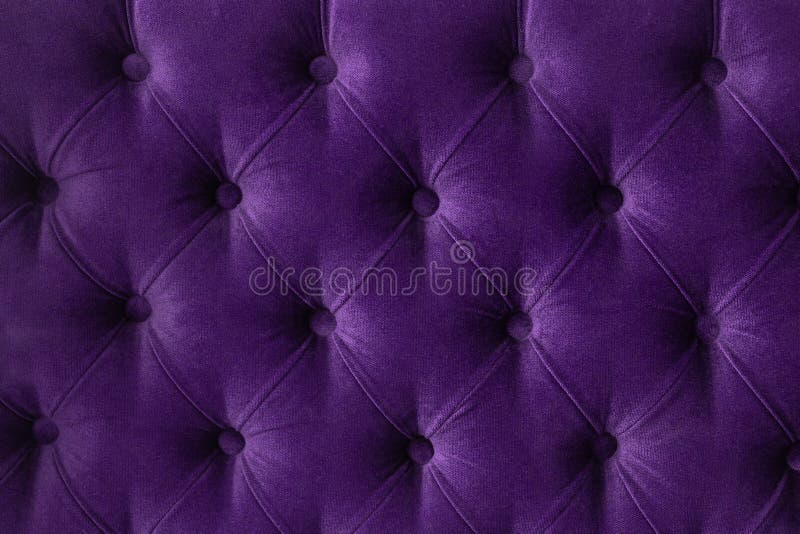 Quilted velour buttoned purple violet color fabric wall pattern background. Elegant vintage luxury sofa upholstery. Interior plush backdrop. Quilted velour buttoned purple violet color fabric wall pattern background. Elegant vintage luxury sofa upholstery. Interior plush backdrop