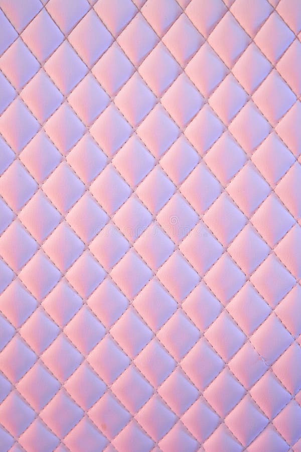 Geometric diamond pattern quilted PU leather in neon light. gradient mosaic textured multi-colored background. wrinkled abstract 80s texture with multiple colors. Geometric diamond pattern quilted PU leather in neon light. gradient mosaic textured multi-colored background. wrinkled abstract 80s texture with multiple colors