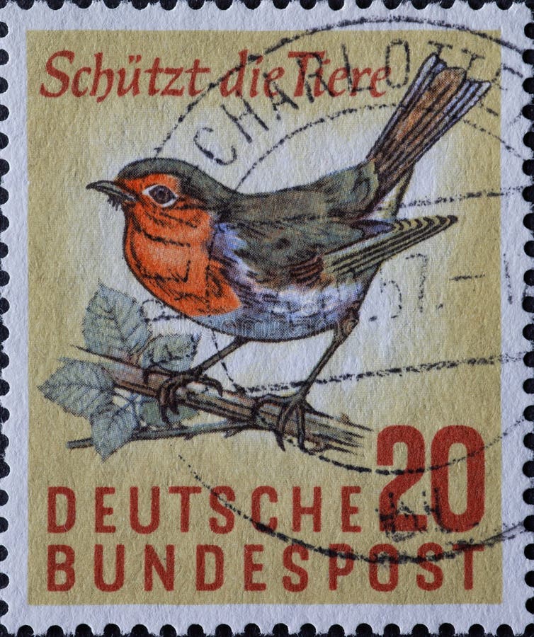 GERMANY - CIRCA 1957: This postage stamp shows a robin sitting on a path. Text: Protects the animals . GERMANY - CIRCA 1957: This postage stamp shows a robin sitting on a path. Text: Protects the animals .