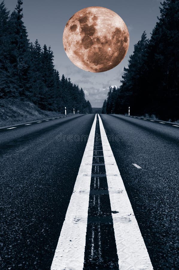 Large surreal full-moon hovering above a lonely country-road, trees and forest. Large surreal full-moon hovering above a lonely country-road, trees and forest