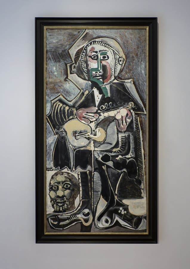 Pictured is an oil on canvas painting by Spanish artist Pablo Picasso titled The Guitarist on display in the Dallas Museum of Art in Dallas, Texas. The aging Picasso completed the painting in 1965 and the arresting head in the left lower corner is thought to be a self-portrait of the artist. He was born in 1881 and died in 1973. Pictured is an oil on canvas painting by Spanish artist Pablo Picasso titled The Guitarist on display in the Dallas Museum of Art in Dallas, Texas. The aging Picasso completed the painting in 1965 and the arresting head in the left lower corner is thought to be a self-portrait of the artist. He was born in 1881 and died in 1973.