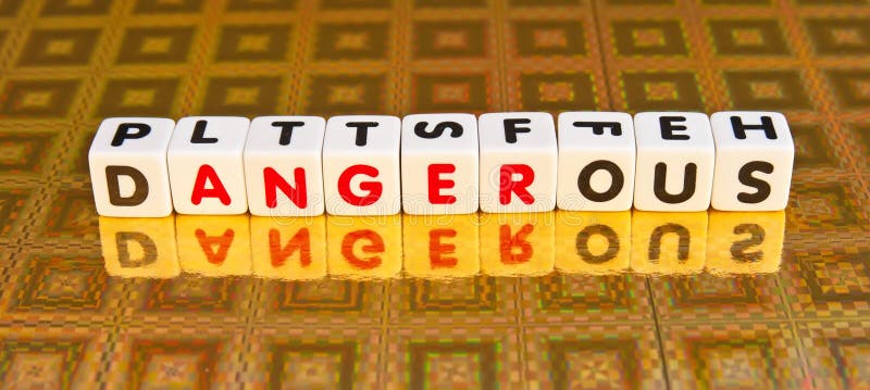 Text ' dangerous ' in uppercase letters inscribed on small white cubes with ' anger ' delineated in red letters, gold background. Text ' dangerous ' in uppercase letters inscribed on small white cubes with ' anger ' delineated in red letters, gold background.