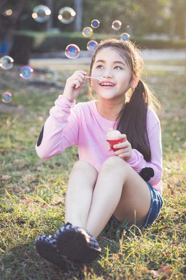 Outdoor bubble asian young
