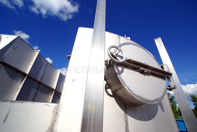 Industrial zone, Steel pipelines on blue cloudy sky. Industrial zone, Steel pipelines on blue cloudy sky