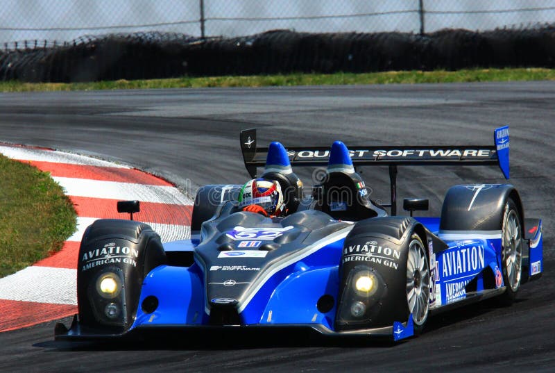 Aviation American Gin sponsored race car makes the sharp turn at the professional motorsports racing event, International Motor Sports Association, Sports car club of America, WC, Central Ohio, United States. Aviation American Gin sponsored race car makes the sharp turn at the professional motorsports racing event, International Motor Sports Association, Sports car club of America, WC, Central Ohio, United States