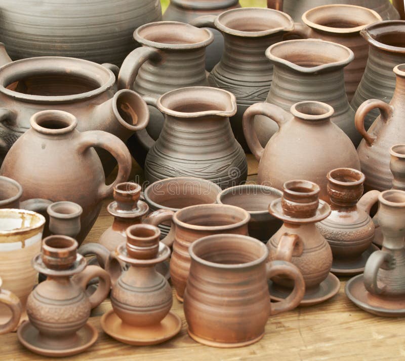 Ceramics are for sale at an outdoor market. Ceramics are for sale at an outdoor market